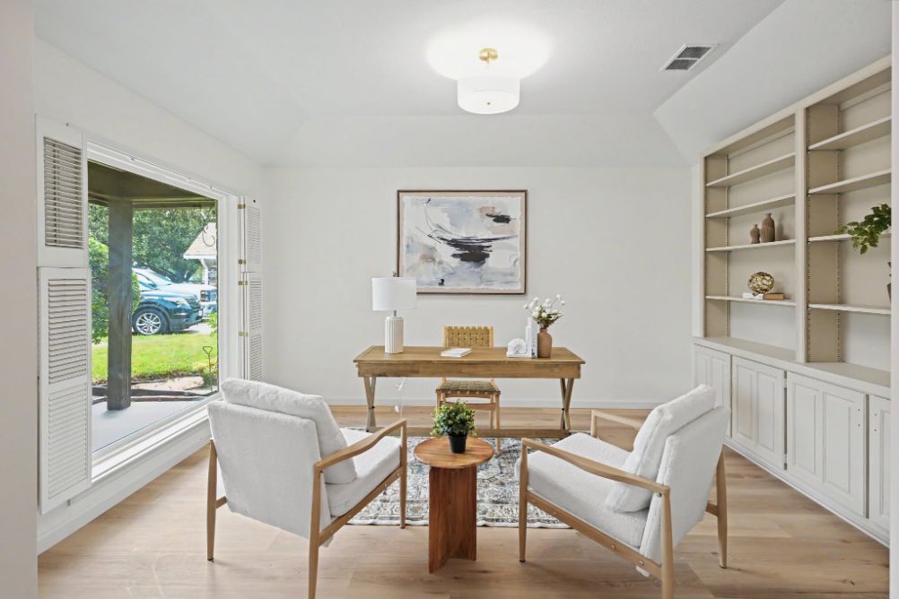 Bright home office staged with natural wood and soft neutral seating